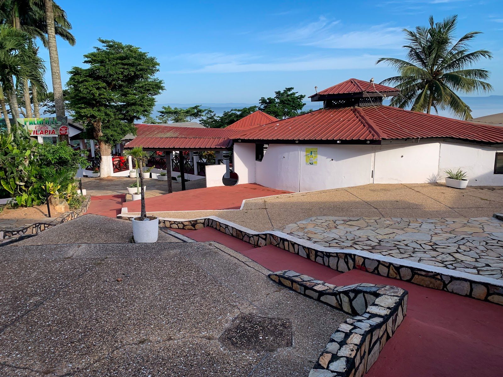 Palm Hill Hotel buildings, stone terraces and palms