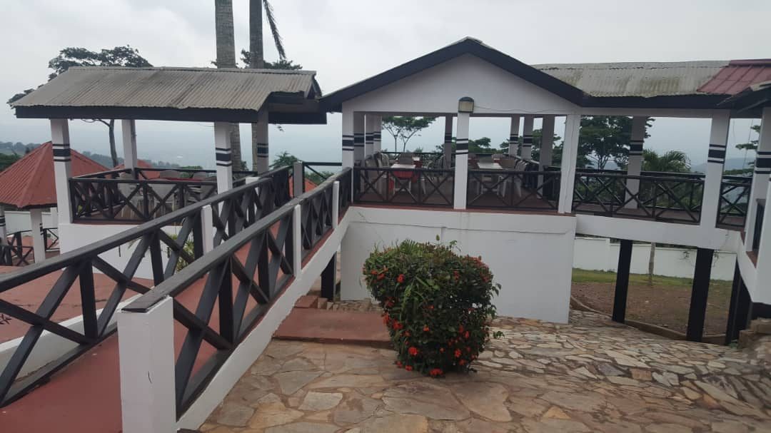 Open-air terraces and covered seating at Palm Hill Hotel