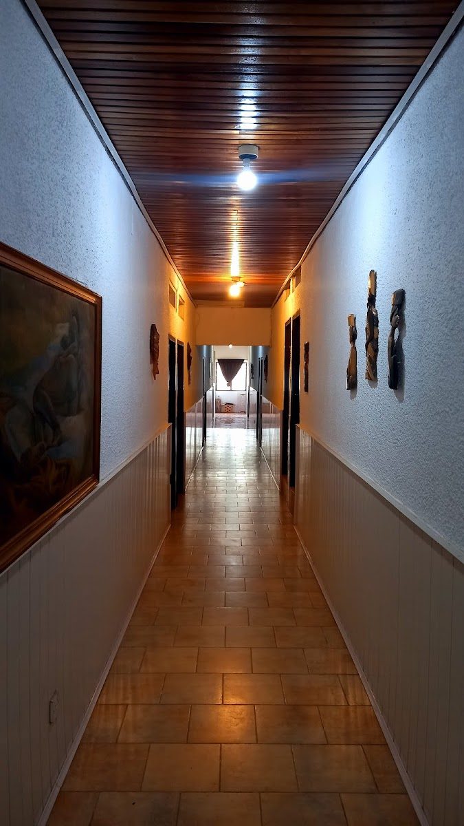 Warmly lit interior corridor at Palm Hill Hotel